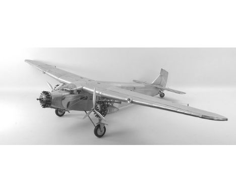 A Junkers 87B 1930's design paratroop carrier scale model aircraft, white sheet metal with bull's eye lights, adjustable flap