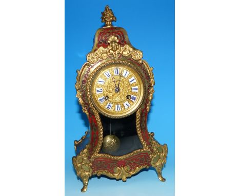 A 19th century Louis XIV style ormolu and boulle work mantel clock of waisted form, with French striking drum movement   