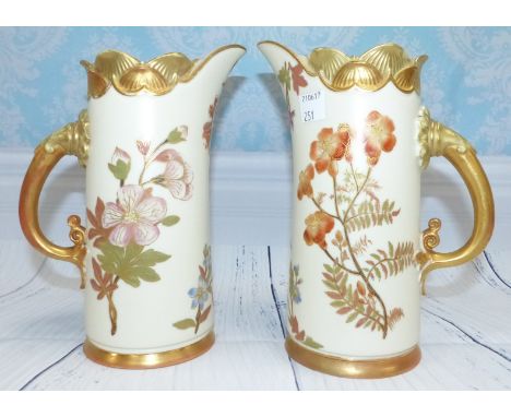 A pair of late 19th Century Royal Worcester porcelain jugs, peach ground height 7.5"