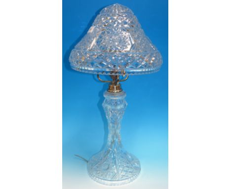 A large cut glass table lamp with mushroom shade                                                                             