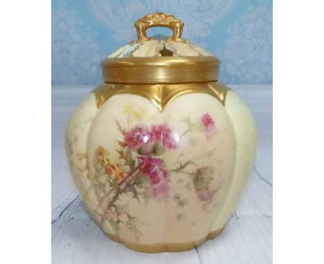 A late 19th Century Royal Worcester porcelain covered vase of spherical segmented form, with pierced cover and internal lid, 