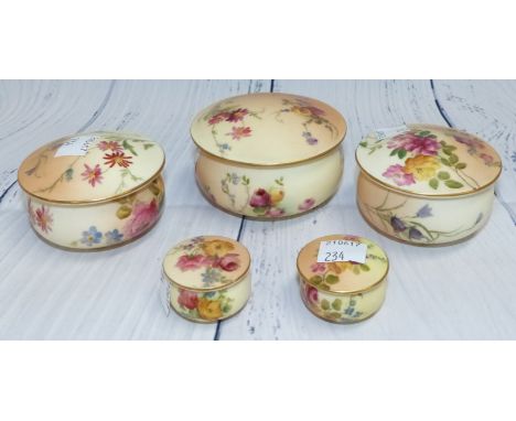 Two pairs of late 19th Century Royal Worcester porcelain covered trinket pots with hand painted with floral decoration agains