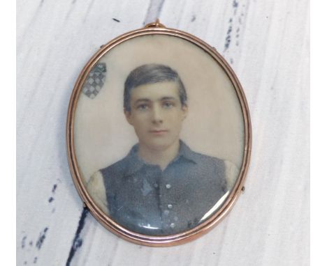 An early 19th century head and shoulders miniature portrait on ivory of a young man in open shirt, inscribed on vellum to the