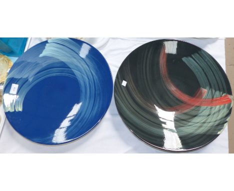 A large 1970's Poole charger by Anita Harris, signed, diameter 16"; a similar blue charger, unsigned, diameter 16" (some mino