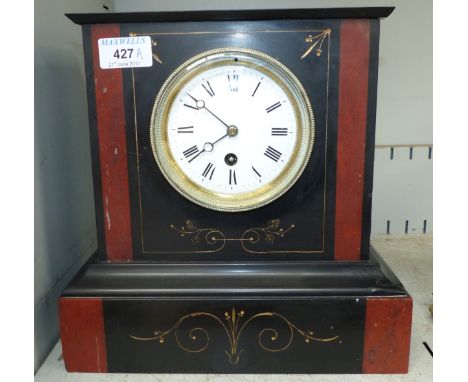 A late Victorian black slate mantel clock with 8-day timepiece movement