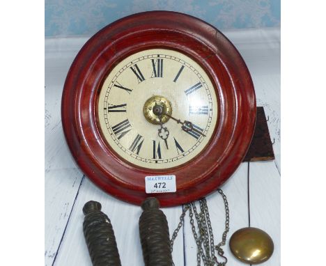 A Black Forest postman's alarm wall clock with pendulum and weights