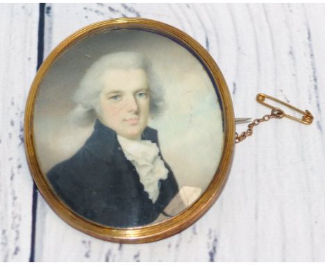 An early 19th century miniature portrait on ivory, head and shoulders of a young man, with memorial back having hair weave, 6