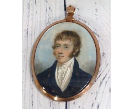 An early 19th century head and shoulders miniature portrait on ivory of a young man, memorial back with seed pearl mounted lo