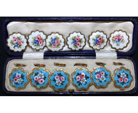 A set of 6 buttons, late 19th century, floral enamelled decoration on blue ground, cased; a similar set, white enamel