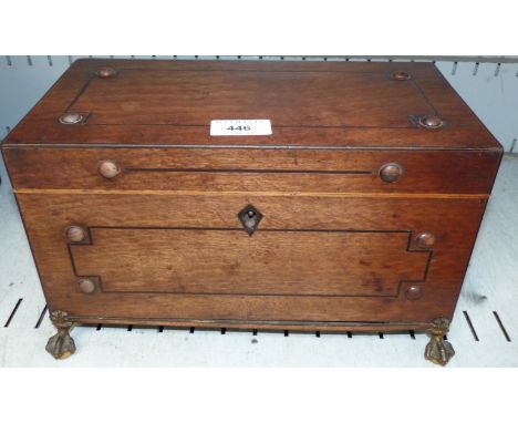 A late Georgian ebony strung mahogany two division tea caddy with original glass bowl, ormolu ball and claw feet, 12"