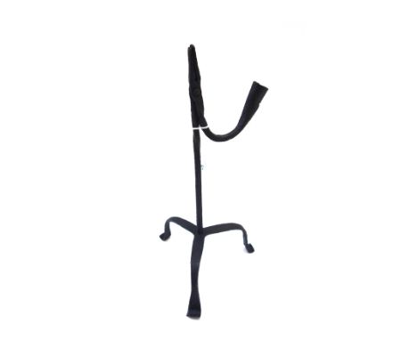 An 18th century wrought iron rush light, with partial wrythen twist stem over three shaped legs (a.f), 33cm high.