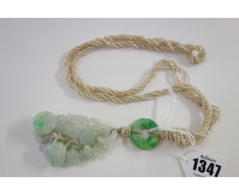 A Chinese jadeite pendant, 20th century, carved as branches of peaches and finger citron, the stone with lavender and green i