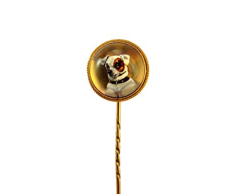 A Victorian gold mounted reverse painted intaglio stick pin, decorated with the head of a small white and brown dog. Illustra