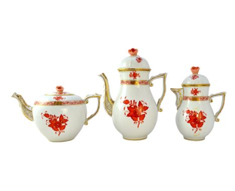 A Herend porcelain part tea service decorated in the 'Rust Bouquet' pattern, comprising; a coffee pot and cover, a teapot and