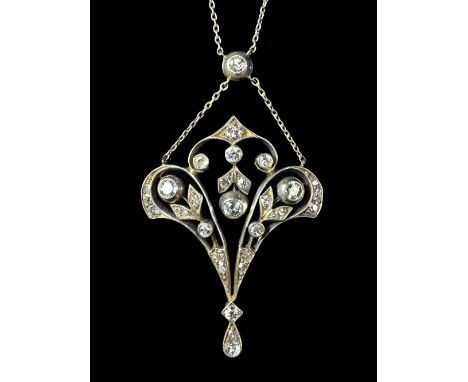 A diamond set pendant, in an Art Nouveau pierced openwork and foliate design, mounted with cushion shaped diamonds and with t