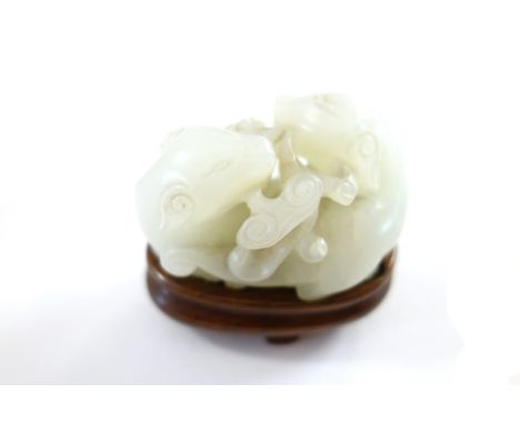 A Chinese white jade group of two cats, Qing Dynasty, 18th/19th century, each holding a sprig of lingzhi  in its mouth, 5cm.l
