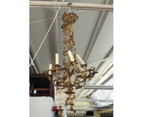 A French ormolu six light chandelier, late 19th century, the spiral twist stem issuing parallel spiral twist foliate scroll a