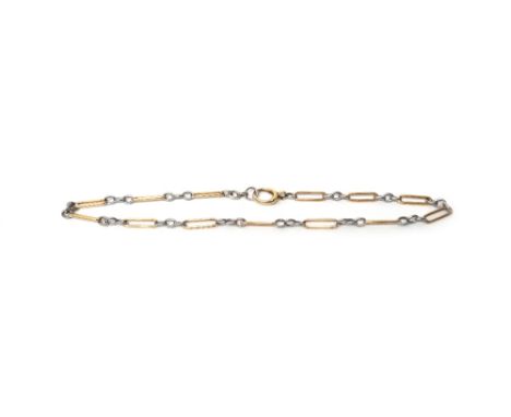 A two colour gold bar and oval link chain, fitted with a large boltring clasp, weight 28.5 gms.