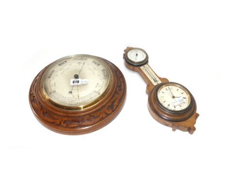 A circular walnut carved wall barometer compendium by 'Jas Pithial London' with subsidiary thermometer (30cm diameter) and a 