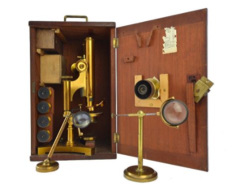 An R. J. Beck binocular microscope, late 19th century, No. 10880, with rack and pinion focusing, four eye pieces, four object