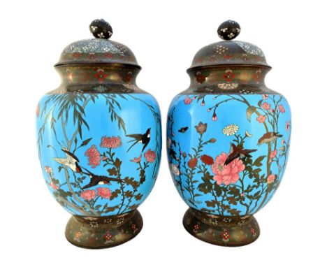 A pair of Japanese turquoise-ground cloisonné enamel vases and covers, Meiji period, each ovoid vase worked with birds and in