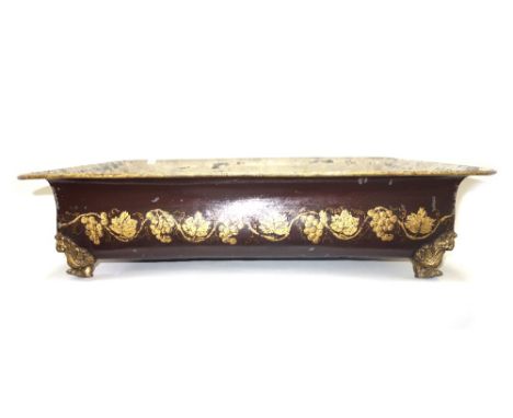 A Regency style tôle peinte planter of rectangular form, gilt decorated with a band of fruiting vines against a brown ground,