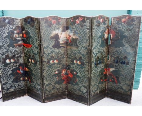 A 19th century arch top brass studded six fold draft screen, painted with fruiting vines and birds of paradise, within a trel