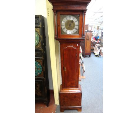 An early 18th century fruitwood cased 30 hour longcase clock with plain dial flanked by pillared supports over a waisted trun