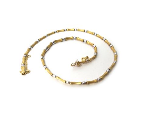 A two colour gold necklace, in a waisted bar with a textured finish and polished bead link alternating design, on a snap clas