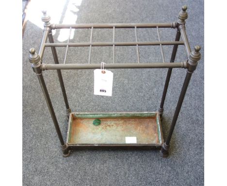 A Victorian tubular brass twelve division stick stand, of rectangular form, with turned finials and a metal drip tray, 64.5cm