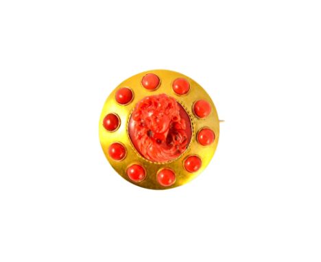 A Victorian carved coral brooch, of circular form, mounted with the carved coral portrait of a lady to the centre, within a r