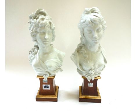 A pair of Royal Worcester white glaze porcelain busts, 'Night' and 'Day', by Arnold Machin, circa 1970, with incised marks, o