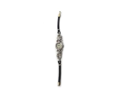 A lady's diamond set dress wristwatch, with an associated jewelled Swiss movement, the case surround and the strap mountings 