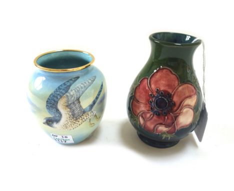 A Moorcroft "anemone" pottery vase, circa 1930, green/blue ground, 9.5cm high, and a Moorcroft enamel vase, 'Peregrine Falcon