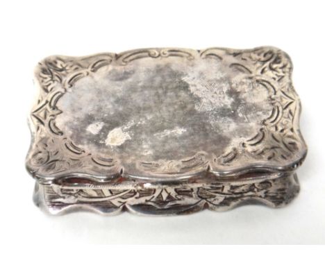 A Victorian silver snuff box by Hilliard & Thomason, of shaped rectangular form, having engraved decoration, Birmingham 1875,