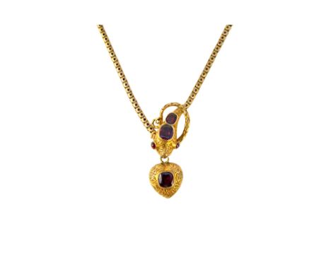 A Victorian gold and garnet set necklace, the front designed as a serpent's head, with a heart shaped pendant locket fitted t