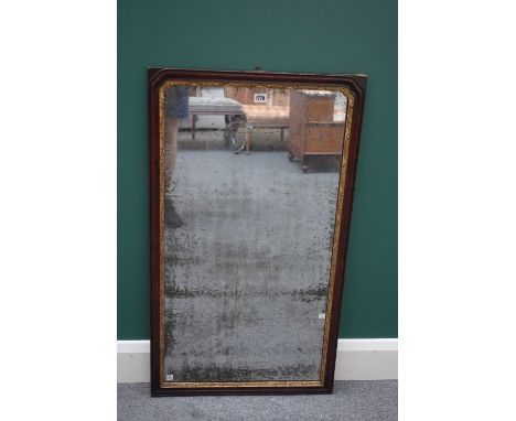 A George II parcel gilt walnut framed rectangular wall mirror, with rounded arch top, 55cm wide x 95cm high.