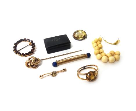 A gold and lapis lazuli bar brooch with a beaten finish, detailed 585, three further brooches and pins, a Victorian stick pin