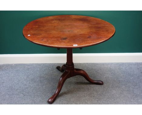 A mid-18th century mahogany occasional table, the circular snap top on bird cage mechanism and tripod base, 90cm wide.