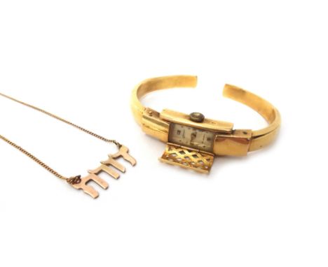 A lady's gold bangle wristwatch, detailed 0,750, gross weight excluding the movement 10 gms and a gold necklace, with a Hebre