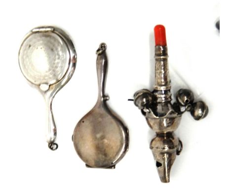 A silver rattle, with engraved decoration, fitted with four bells, a fifth bell present, but loose, the sixth bell lacking, w