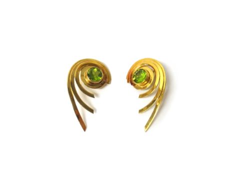 A pair of 18ct gold and peridot set single stone earclips, each in a swirling design, collet set with the circular cut perido