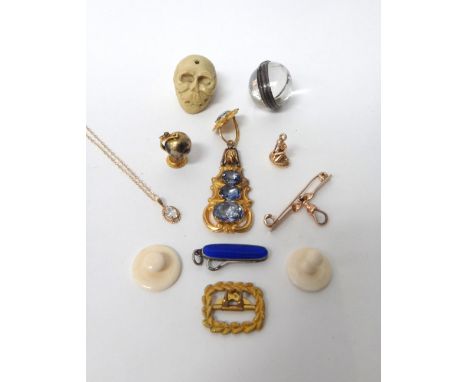 A gold and sapphire set single earring, mounted with four foil backed cushion shaped sapphires, circa 1840, a gold mounted gl