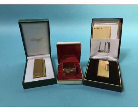 A boxed Dunhill lighter, a Davidoff lighter and one other