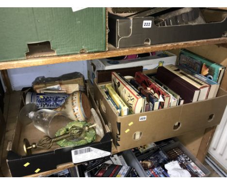 A shelf of assorted, books etc.