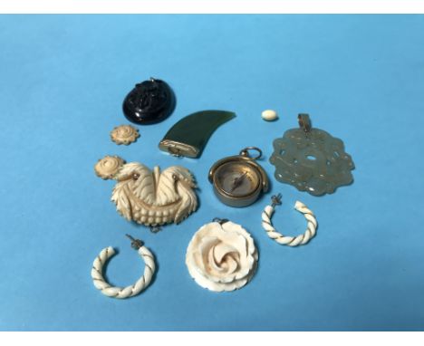 Two gold mounted jade pendants, a jet pendant etc.