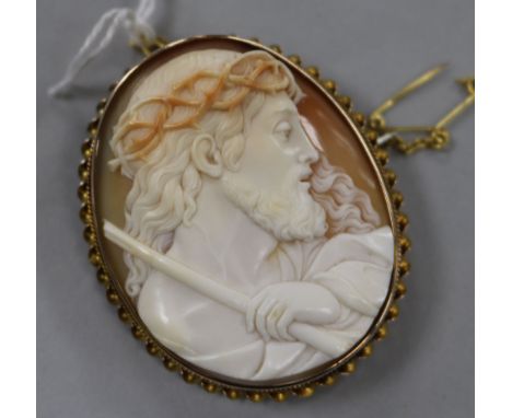 A yellow metal mounted oval cameo brooch carved with a portrait of Jesus Christ,