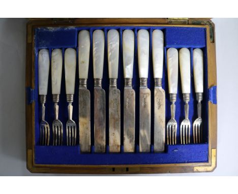 A cased set of twelve pairs of late Victorian mother of pearl handled silver dessert eaters, Sheffield, 1894.