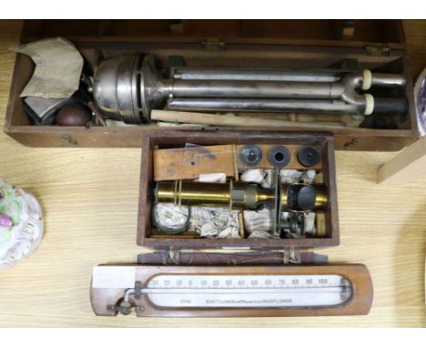 A Negretti & Zambra cased Assman's Psychrometer, a boxed microscope and a thermometer