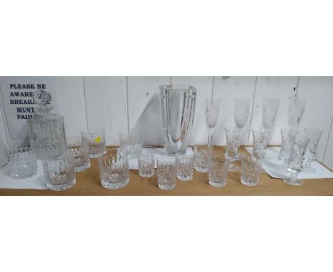 A Waterford glass vase 25cm, makers mark to underneath; a decanter with stopper and twenty-one assorted drinking glasses (23)